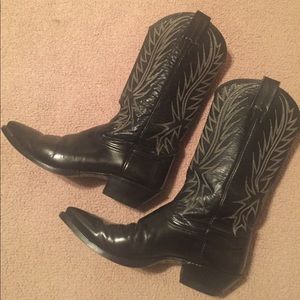 Nocona black leather boots with white stitching.